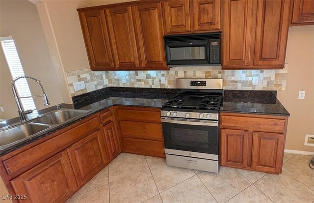 8159 Base Camp Ave, Las Vegas, NV 89178 - kitchen with black microwave, gas range, and brown cabinetry