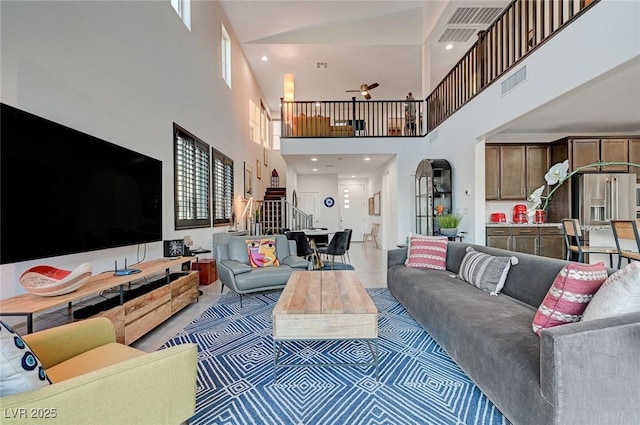 2669 Via Monet, Henderson, NV 89044 - living area with stairway, a towering ceiling, and ceiling fan