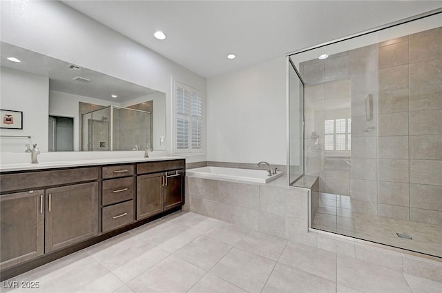 2669 Via Monet, Henderson, NV 89044 - bathroom featuring a shower stall, double vanity, a bath, recessed lighting, and tile patterned flooring