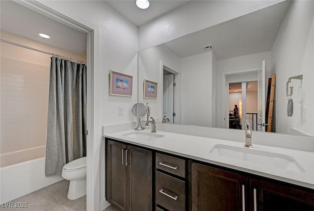 2669 Via Monet, Henderson, NV 89044 - bathroom with toilet, double vanity, tile patterned floors, and shower / bath combo