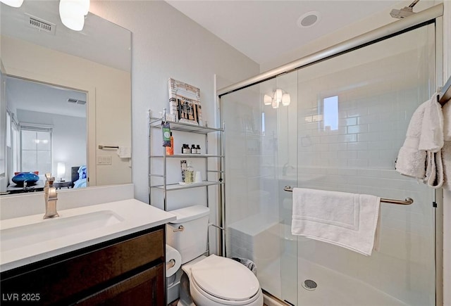 2669 Via Monet, Henderson, NV 89044 - ensuite bathroom with a shower stall, vanity, and toilet