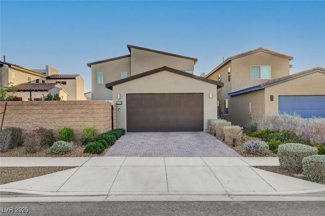 2669 Via Monet, Henderson, NV 89044 - view of front of house featuring a garage, driveway, and stucco siding