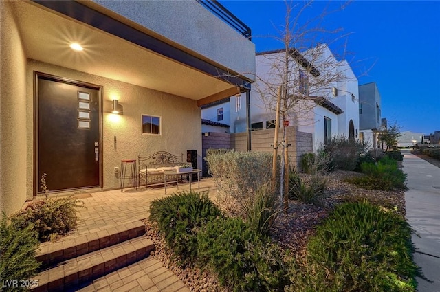 2669 Via Monet, Henderson, NV 89044 - view of side of home with stucco siding and a patio