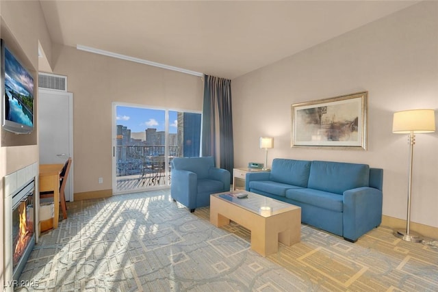 211 E Flamingo Rd Unit 1617, Las Vegas, NV 89169 - living area featuring carpet flooring, a fireplace, and baseboards