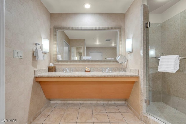 211 E Flamingo Rd Unit 1617, Las Vegas, NV 89169 - full bathroom featuring double vanity, a stall shower, and tile patterned flooring