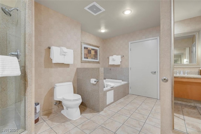 211 E Flamingo Rd Unit 1617, Las Vegas, NV 89169 - bathroom with tile patterned flooring, vanity, a stall shower, and a garden tub