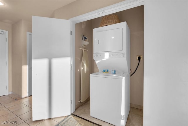 211 E Flamingo Rd Unit 1617, Las Vegas, NV 89169 - laundry room with stacked washer / dryer and light tile patterned floors