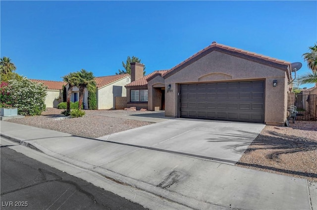 2711 Briarcliff Ave, Henderson, NV 89074 - view of front of property featuring a tile roof, stucco siding, concrete driveway, a garage, and a chimney