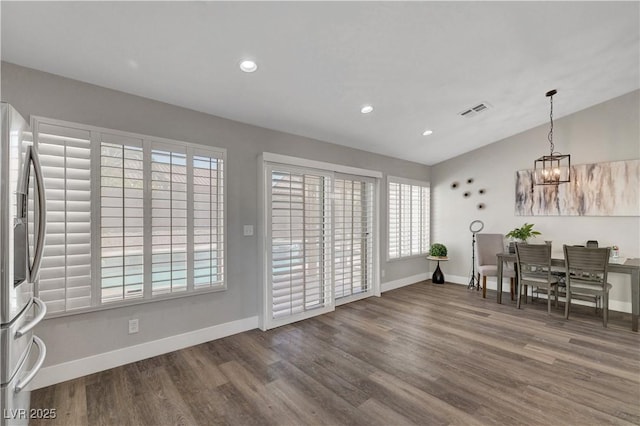 2711 Briarcliff Ave, Henderson, NV 89074 - dining room with baseboards, wood finished floors, a chandelier, recessed lighting, and lofted ceiling