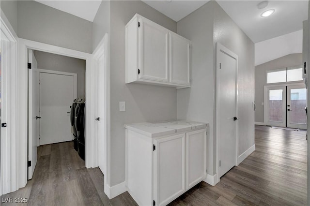 2711 Briarcliff Ave, Henderson, NV 89074 - corridor featuring washer and clothes dryer, wood finished floors, lofted ceiling, baseboards, and french doors