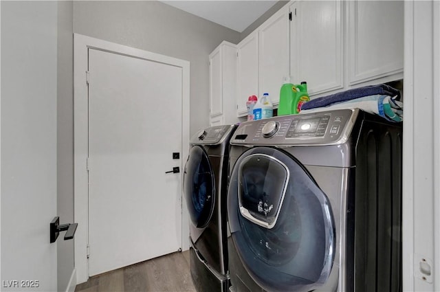 2711 Briarcliff Ave, Henderson, NV 89074 - laundry room with washer and clothes dryer, cabinet space, and wood finished floors