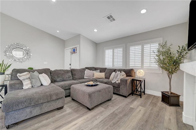 2711 Briarcliff Ave, Henderson, NV 89074 - living room featuring light wood-style flooring, baseboards, and recessed lighting