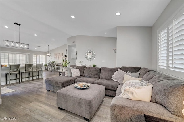 2711 Briarcliff Ave, Henderson, NV 89074 - living area with light wood-style flooring, vaulted ceiling, and recessed lighting