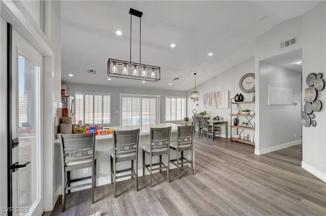 2711 Briarcliff Ave, Henderson, NV 89074 - dining area featuring lofted ceiling, wood finished floors, baseboards, and recessed lighting