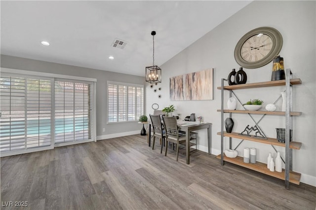 2711 Briarcliff Ave, Henderson, NV 89074 - dining area with wood finished floors, a chandelier, baseboards, lofted ceiling, and recessed lighting