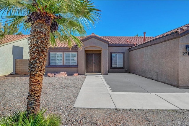 2711 Briarcliff Ave, Henderson, NV 89074 - entrance to property with a tile roof and stucco siding