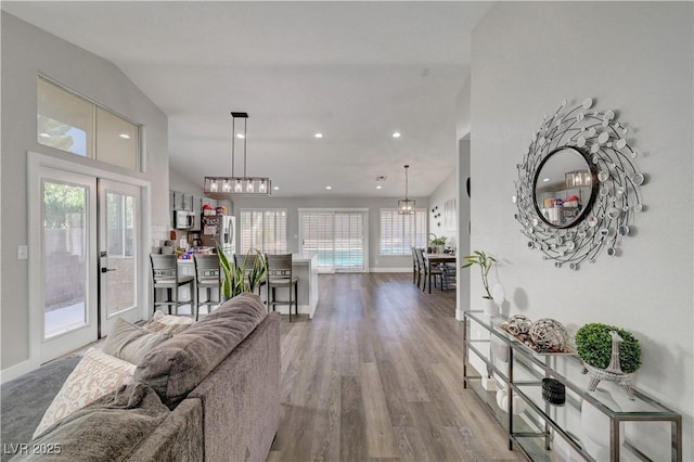 2711 Briarcliff Ave, Henderson, NV 89074 - living area with wood finished floors, baseboards, recessed lighting, and vaulted ceiling
