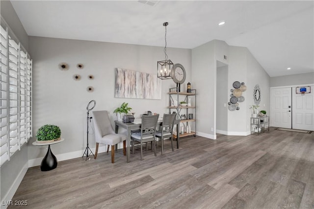 2711 Briarcliff Ave, Henderson, NV 89074 - dining area with lofted ceiling, wood finished floors, baseboards, a chandelier, and recessed lighting