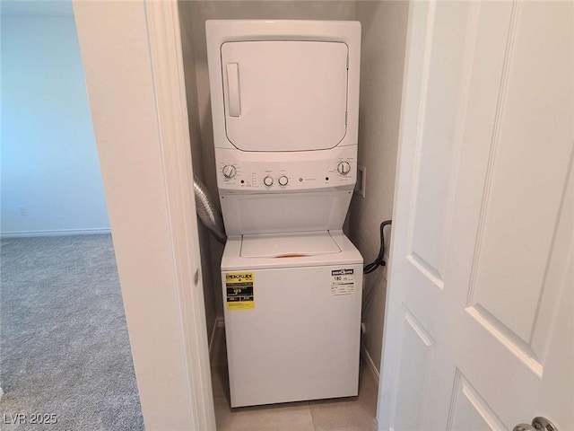 7332 N Decatur Blvd Unit 2, North Las Vegas, NV 89084 - washroom with stacked washer / drying machine and light carpet