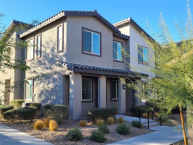 7332 N Decatur Blvd Unit 2, North Las Vegas, NV 89084 - view of front facade with a tiled roof and stucco siding