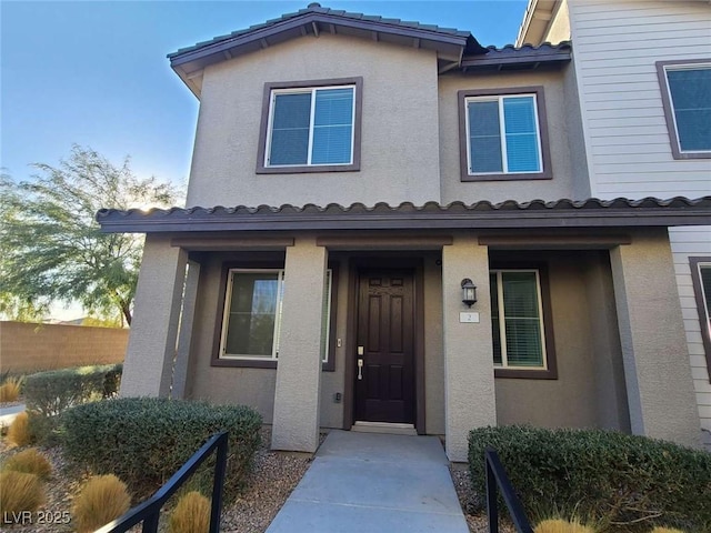7332 N Decatur Blvd Unit 2, North Las Vegas, NV 89084 - view of front facade with a tile roof and stucco siding