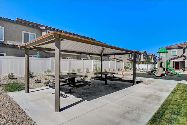 7332 N Decatur Blvd Unit 2, North Las Vegas, NV 89084 - view of patio with a gazebo, a playground, and a residential view