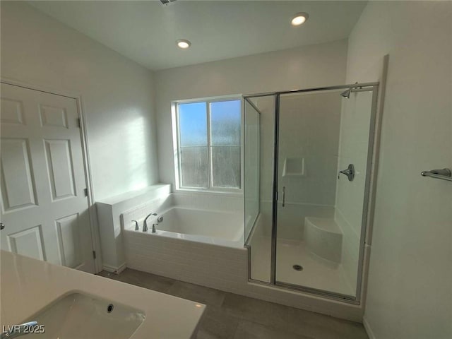 7332 N Decatur Blvd Unit 2, North Las Vegas, NV 89084 - full bathroom featuring a stall shower, a garden tub, tile patterned flooring, and recessed lighting
