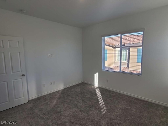 7332 N Decatur Blvd Unit 2, North Las Vegas, NV 89084 - carpeted empty room with baseboards and a smoke detector
