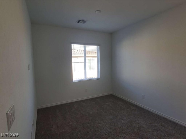 7332 N Decatur Blvd Unit 2, North Las Vegas, NV 89084 - spare room with dark colored carpet and baseboards
