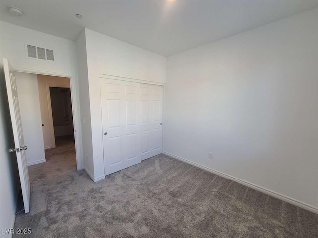 7332 N Decatur Blvd Unit 2, North Las Vegas, NV 89084 - unfurnished bedroom with carpet, baseboards, and a closet