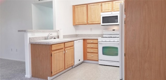5710 E Tropicana Ave Unit 2178, Las Vegas, NV 89122 - kitchen featuring white appliances, a sink, light brown cabinets, light countertops, and light colored carpet