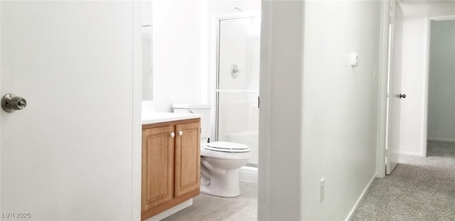 5710 E Tropicana Ave Unit 2178, Las Vegas, NV 89122 - bathroom with toilet, vanity, a shower, and baseboards