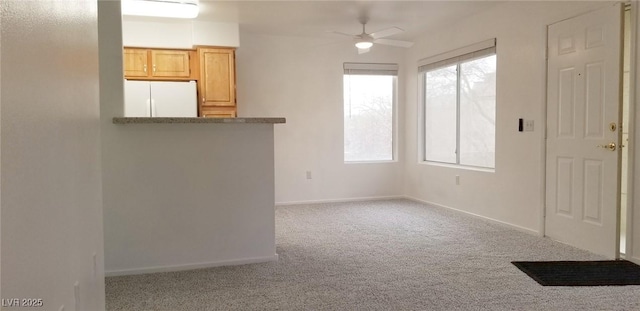 5710 E Tropicana Ave Unit 2178, Las Vegas, NV 89122 - unfurnished room featuring carpet, a ceiling fan, and baseboards