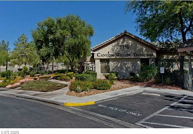 5710 E Tropicana Ave Unit 2178, Las Vegas, NV 89122 - view of building exterior featuring uncovered parking