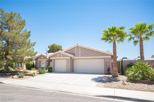 6417 Fisher Ave, Las Vegas, NV 89130 - ranch-style home featuring an attached garage, stucco siding, and driveway