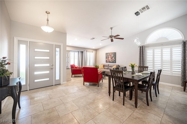 6417 Fisher Ave, Las Vegas, NV 89130 - dining space featuring ceiling fan, baseboards, vaulted ceiling, and light tile patterned floors