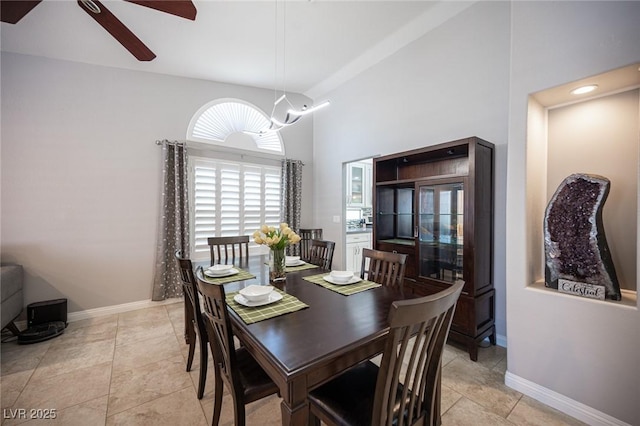 6417 Fisher Ave, Las Vegas, NV 89130 - dining room featuring a ceiling fan, baseboards, and high vaulted ceiling