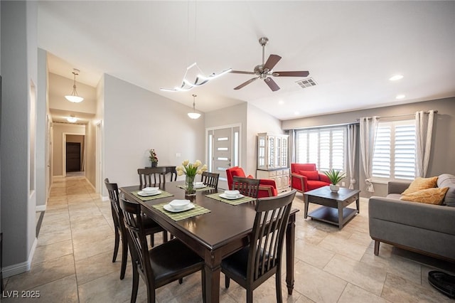 6417 Fisher Ave, Las Vegas, NV 89130 - dining room with lofted ceiling, a ceiling fan, light tile patterned flooring, baseboards, and recessed lighting