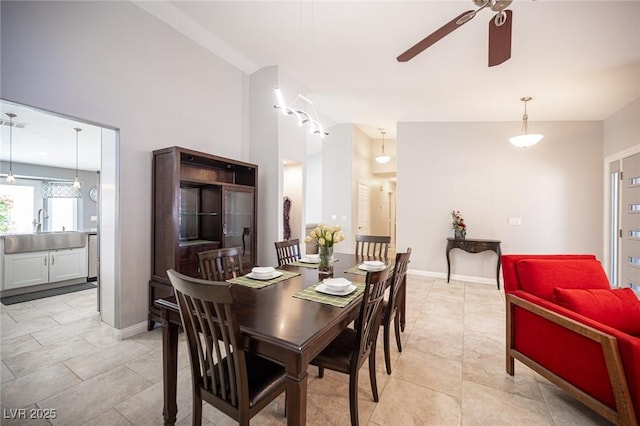 6417 Fisher Ave, Las Vegas, NV 89130 - dining area featuring ceiling fan and baseboards