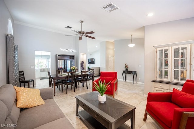 6417 Fisher Ave, Las Vegas, NV 89130 - living area with ceiling fan, baseboards, recessed lighting, and crown molding