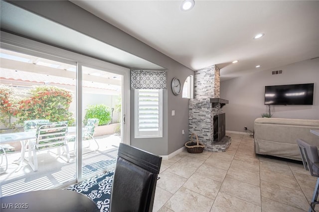 6417 Fisher Ave, Las Vegas, NV 89130 - living room with baseboards, recessed lighting, a fireplace, and light tile patterned flooring