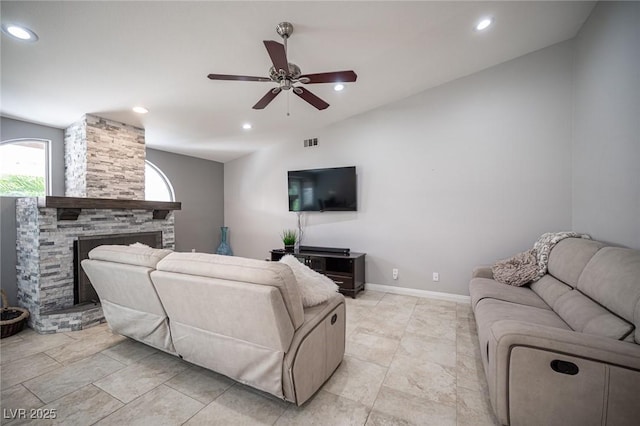 6417 Fisher Ave, Las Vegas, NV 89130 - living room featuring a ceiling fan, a stone fireplace, recessed lighting, and baseboards