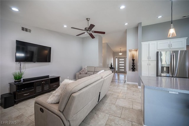 6417 Fisher Ave, Las Vegas, NV 89130 - living area featuring a ceiling fan, recessed lighting, lofted ceiling, and baseboards