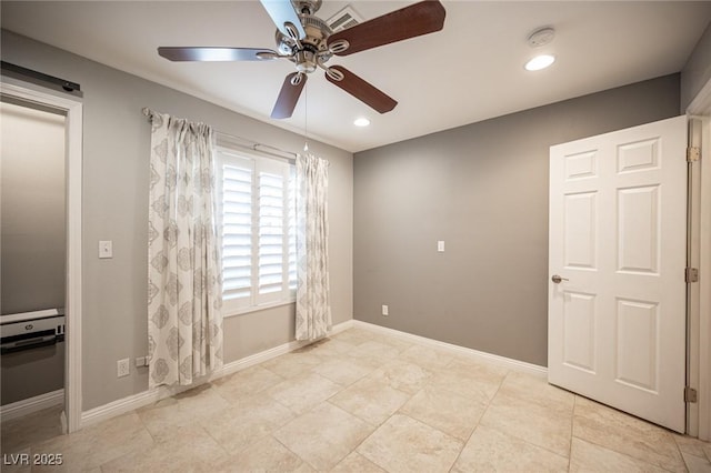 6417 Fisher Ave, Las Vegas, NV 89130 - empty room with ceiling fan and baseboards