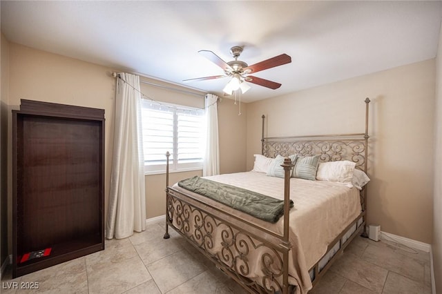 6417 Fisher Ave, Las Vegas, NV 89130 - bedroom with baseboards, ceiling fan, and light tile patterned flooring