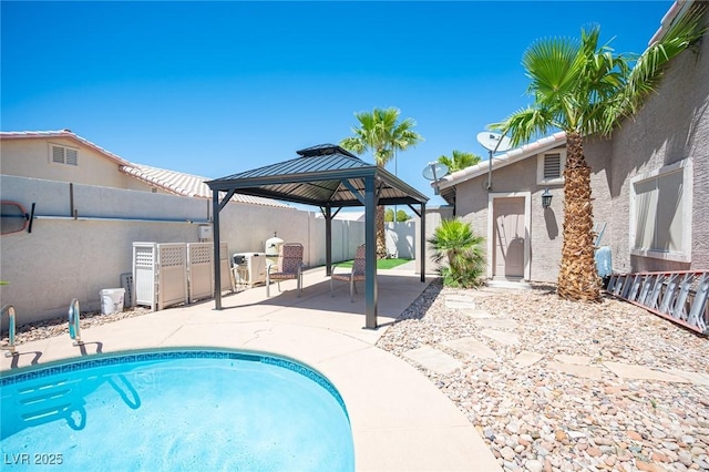 6417 Fisher Ave, Las Vegas, NV 89130 - view of swimming pool with a patio area, a gazebo, and a fenced backyard