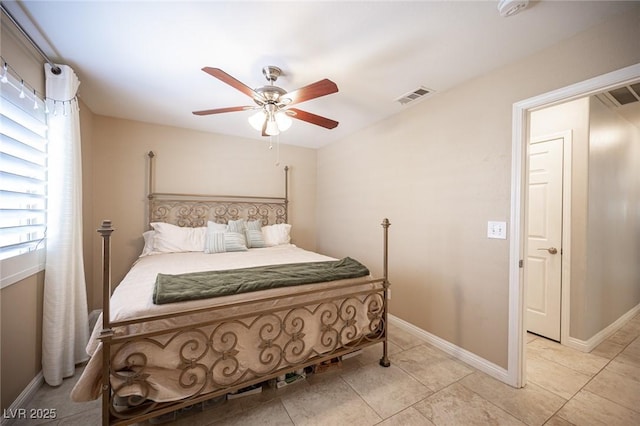 6417 Fisher Ave, Las Vegas, NV 89130 - bedroom with light tile patterned flooring, a ceiling fan, and baseboards