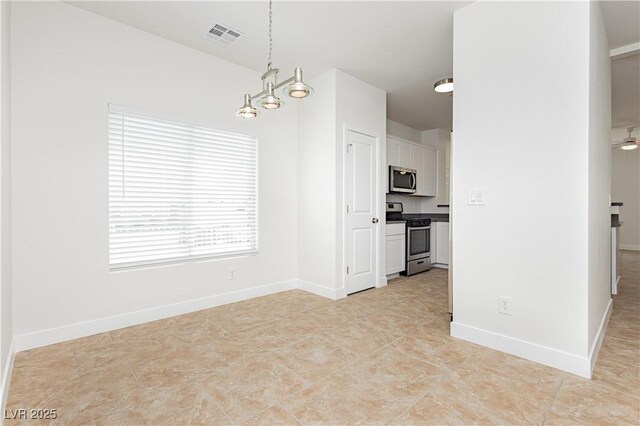 3041 Gary Cooper St Unit 103, Las Vegas, NV 89122 - unfurnished dining area with baseboards