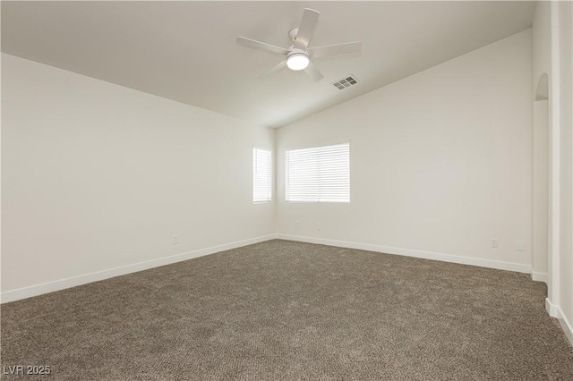 3041 Gary Cooper St Unit 103, Las Vegas, NV 89122 - spare room featuring vaulted ceiling, dark colored carpet, a ceiling fan, and baseboards
