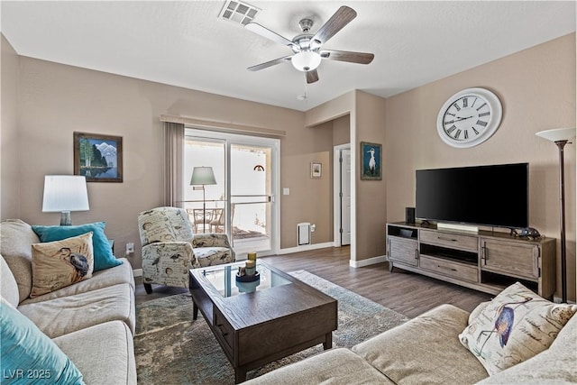 7669 Fieldfare Dr, North Las Vegas, NV 89084 - living area with a ceiling fan, wood finished floors, and baseboards